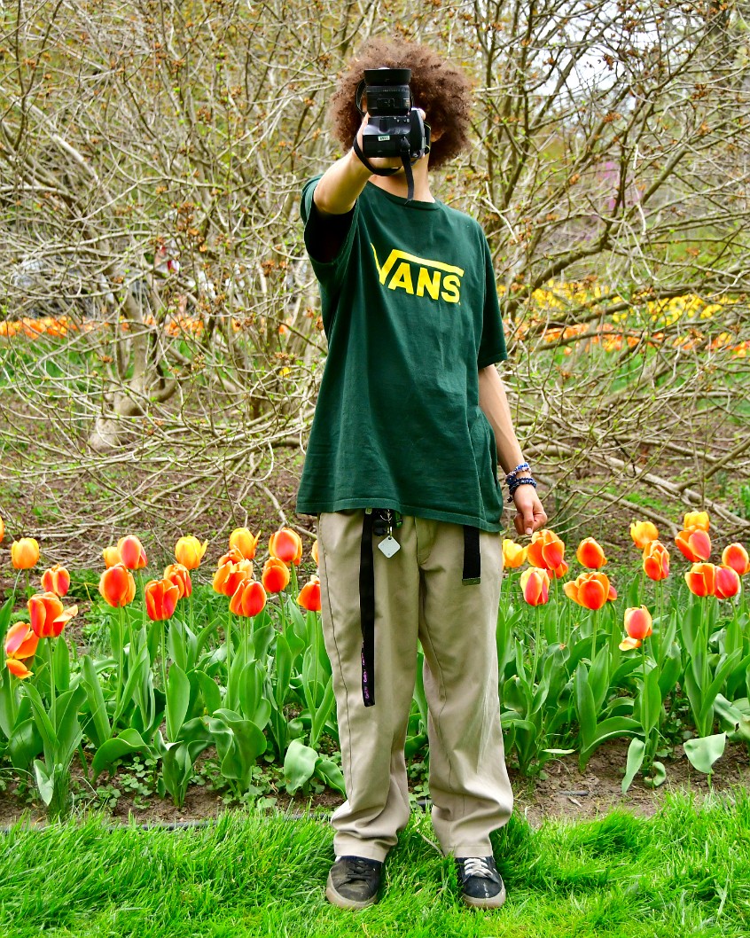 Photographer Malachi Posing Among the Tulips 2